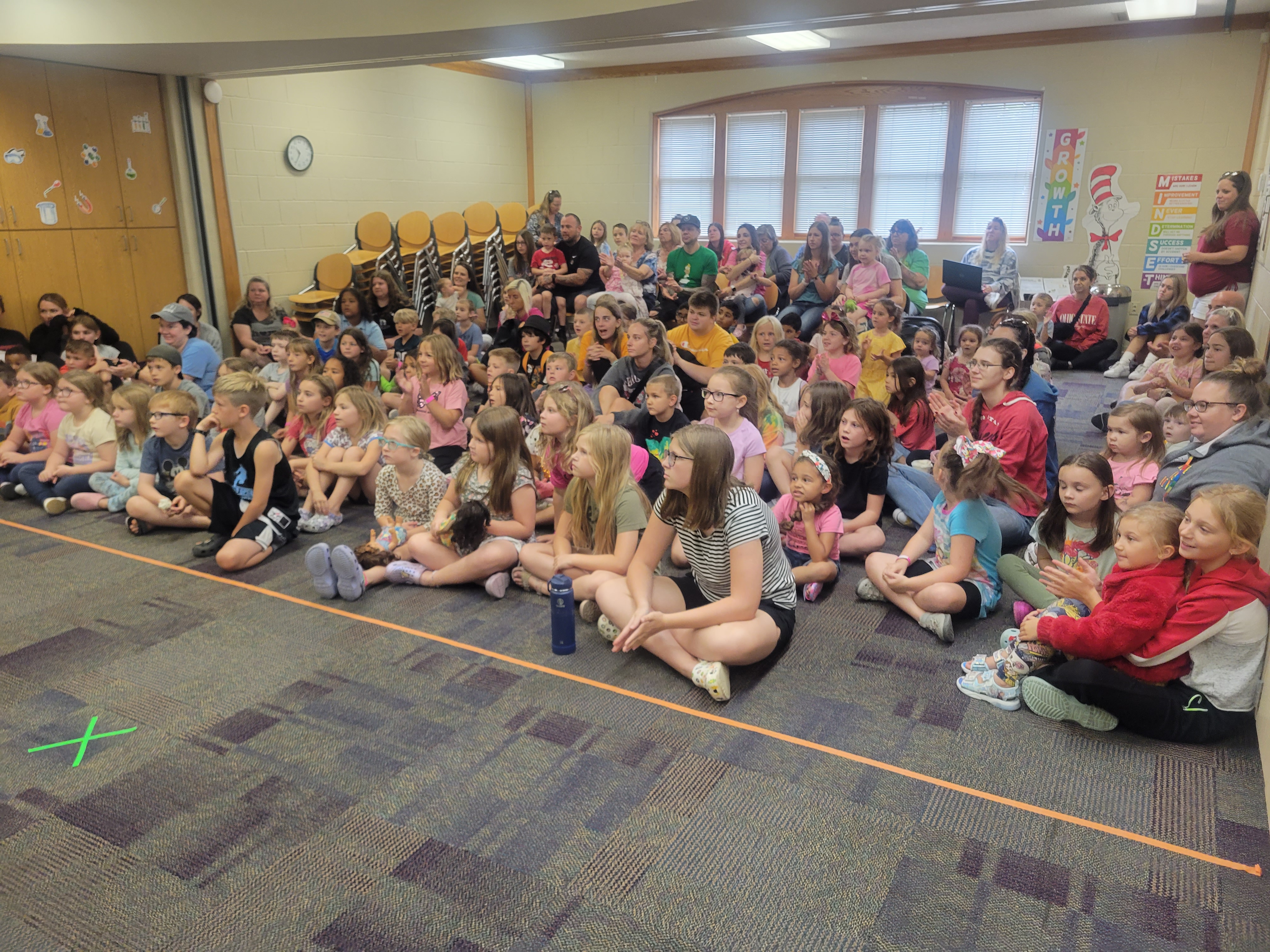 crowd of children waiting for the dino show