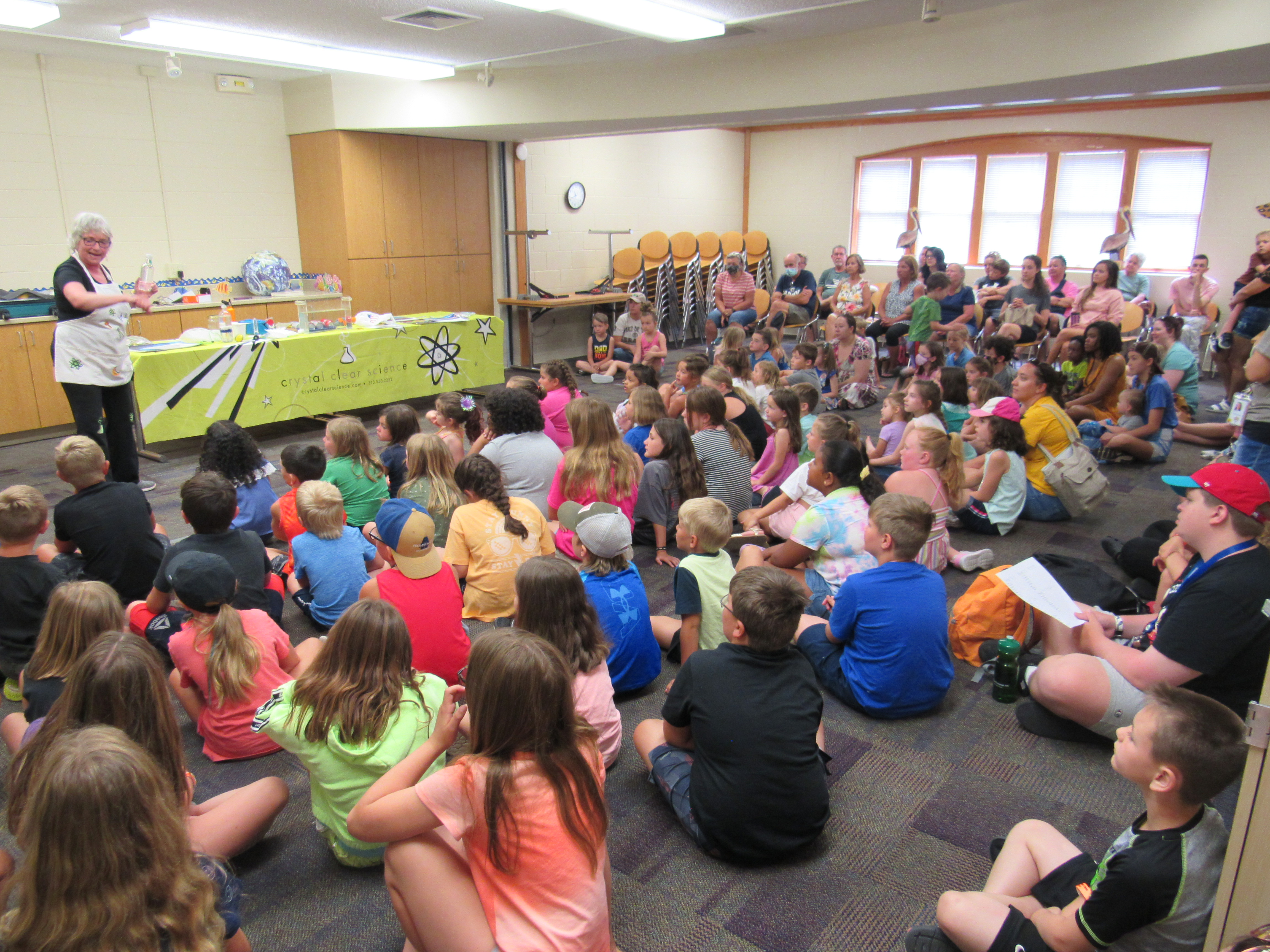 Kids receiving a lecture about sea life