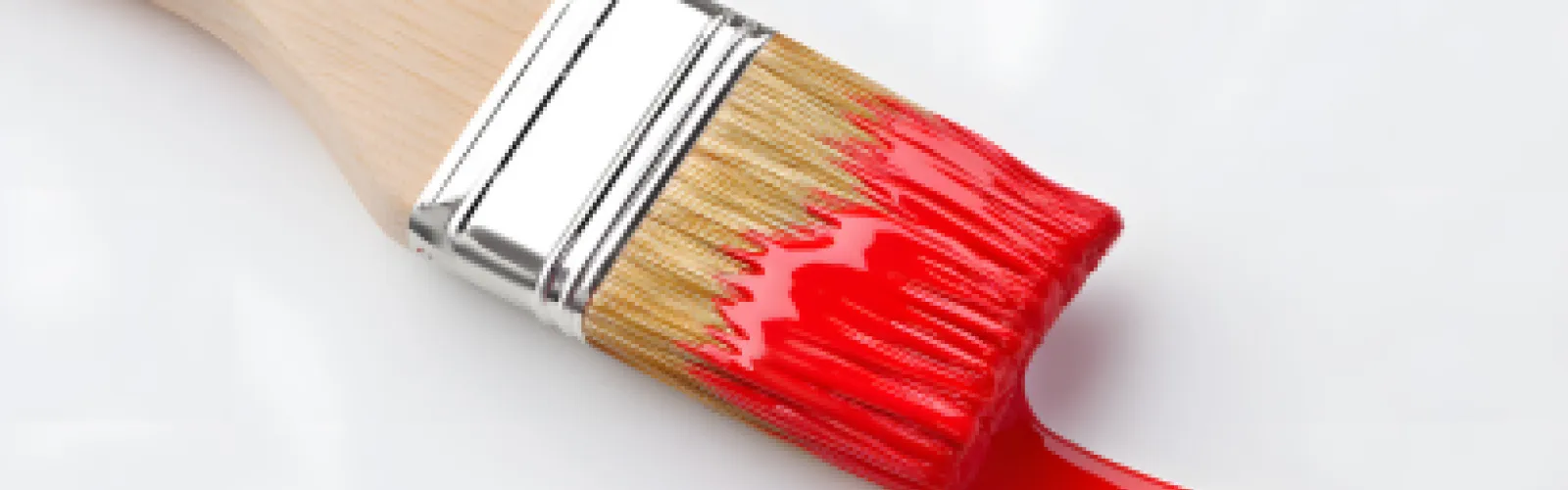 paintbrush with red paint